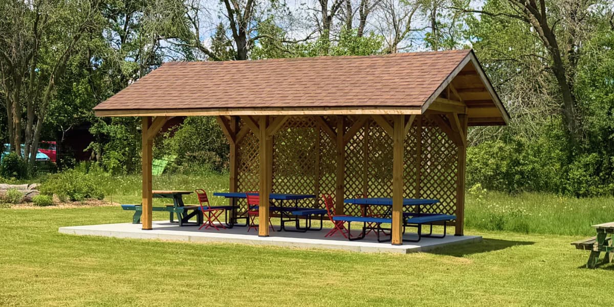 A timber pavilion in a green Amherst Island park